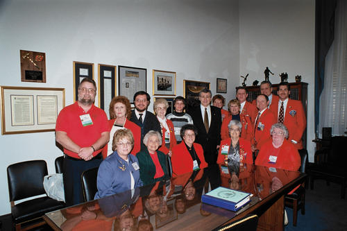 Photo of Hagel posing with members of the Nebraska Chapter of the National Association of Postmasters on January 27, 1999, UNO Libraries' Archives &amp; Special Collections